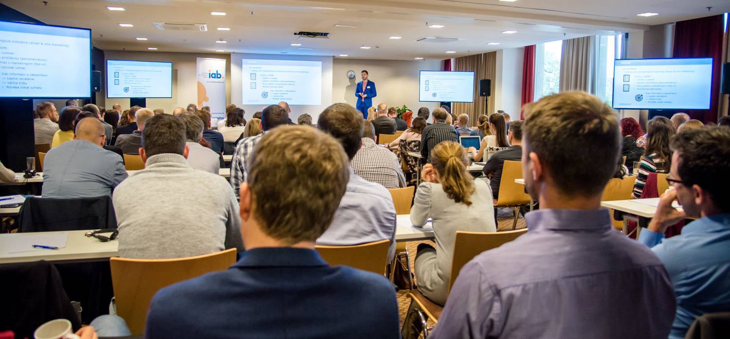 Robert Durec presenting at conference before audience